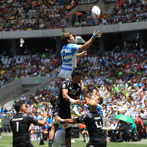 Rugby players going for the ruck at the Rugby World Cup