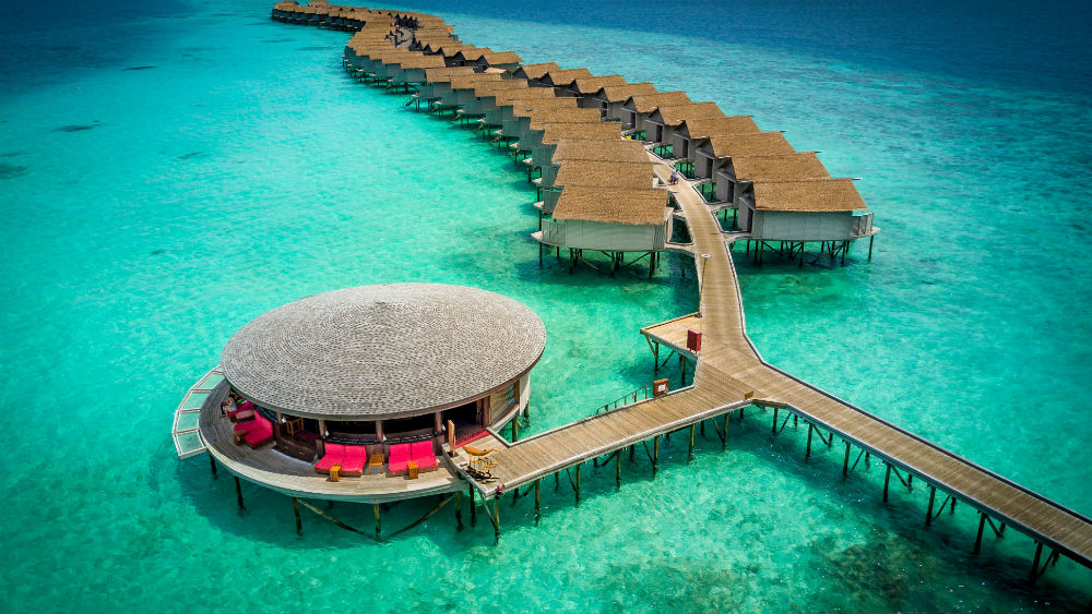 lounge area and villas at the Centara Ras Fushi Resort and Spa Maldives