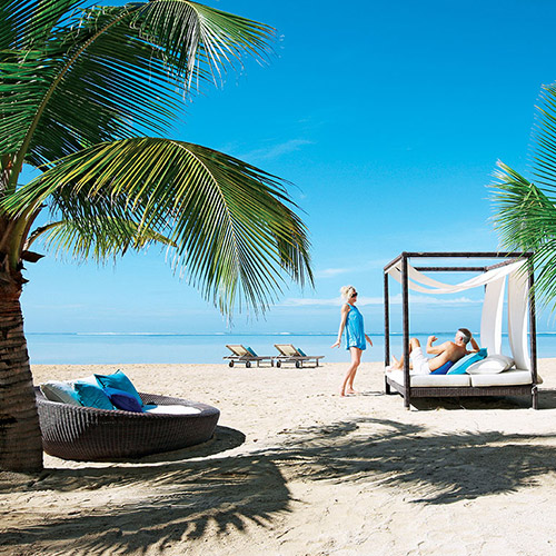 Couple in a beach cabana at Heritage Le Telfair Mauritius