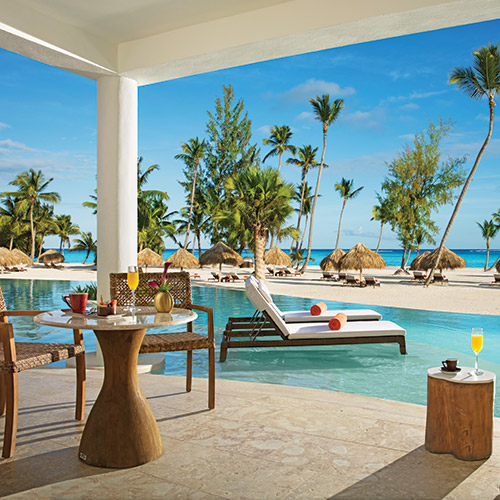 Terrace overlooking the swim out pool and beach at Secrets Cap Cana Resort & Spa in Dominican Republic