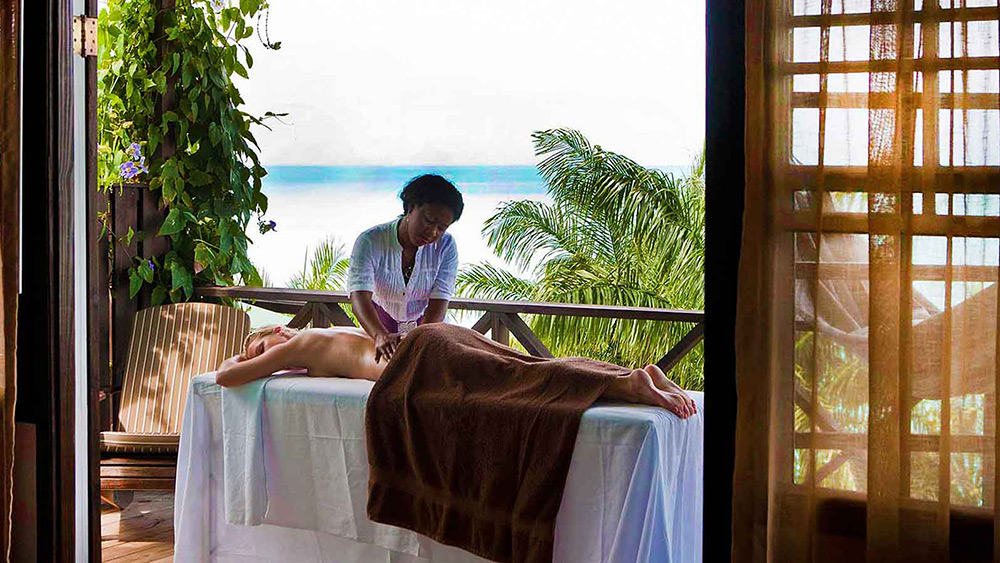 Woman receiving a massage at Cocos Hotel
