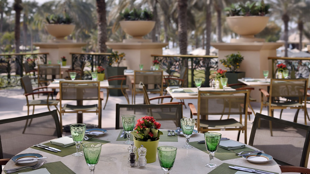 Outdoor seating at Olive Terrace at One&Only Royal Mirage The Palace