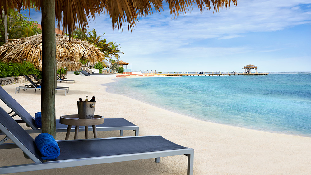 Sun loungers on the beach at Zoetry Montego Bay