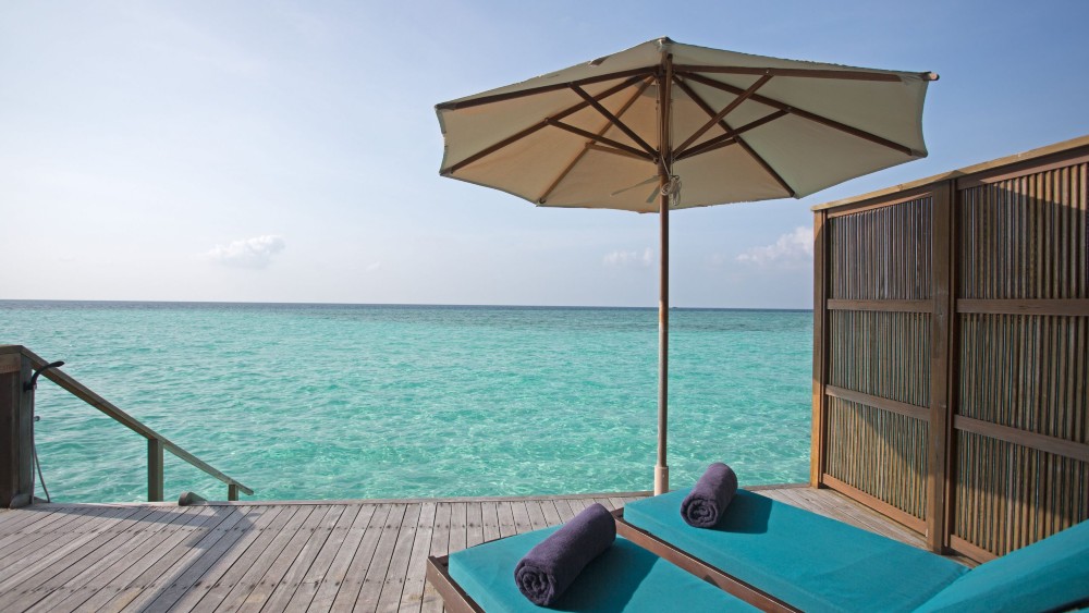 Sun lounges in a water villa at Veligandu Island Resort & Spa
