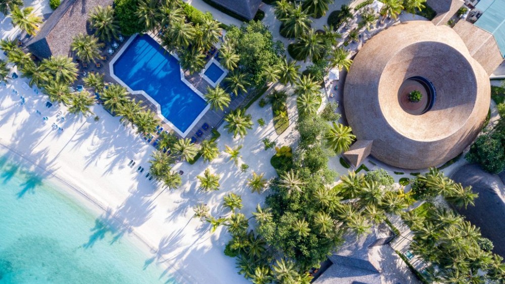 Aerial view of the pool and beach at Meeru Island Resort