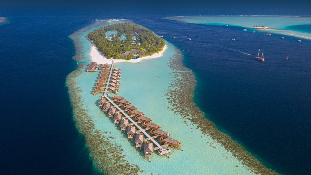 Aerial view of the island and water villas at Vilamendhoo Island