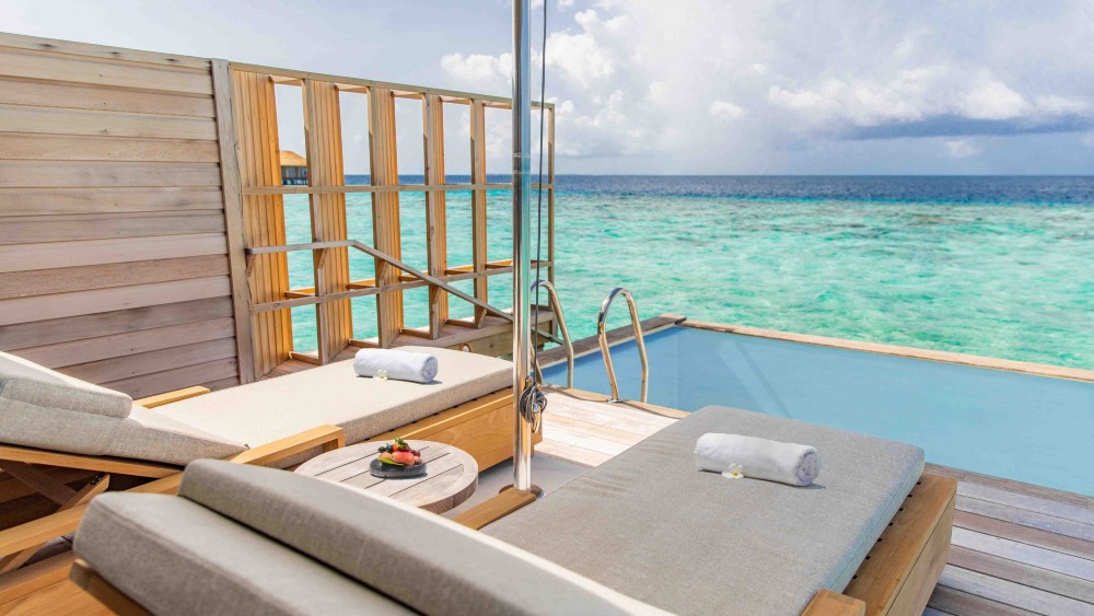 Sun lounges on the deck of the Ocean Pool Villa at Kagi Spa Island