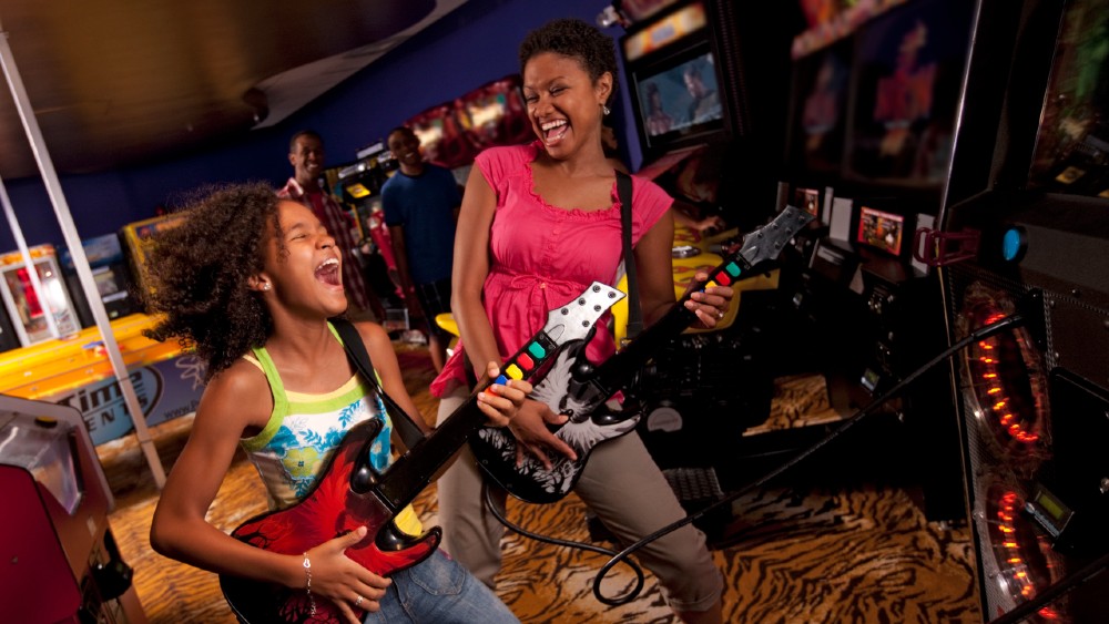Mother & daughter playing guitars at Hard Rock Hotel at Universal