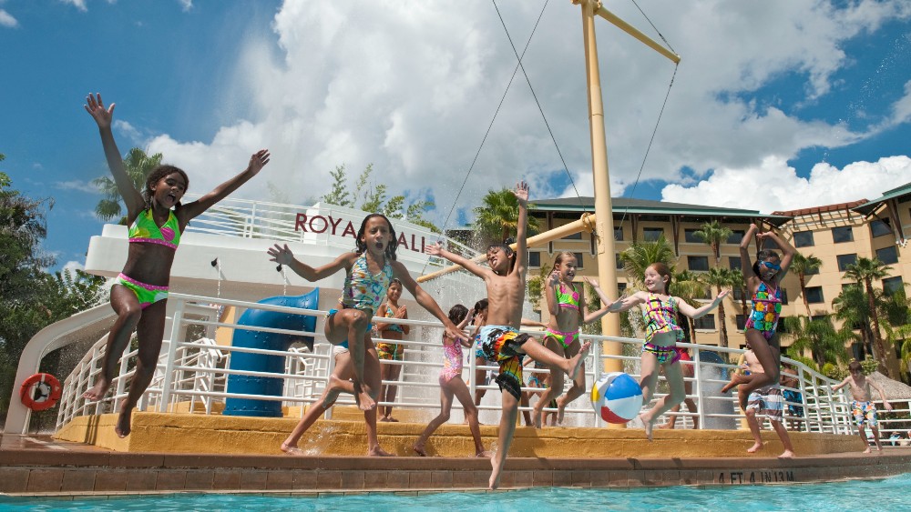 Children jumping into the pool at Loews Royal Pacific Resort at Universal
