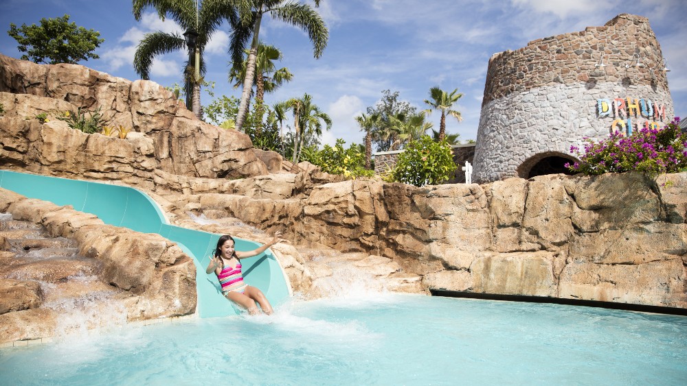 Child on a water slide at Loews Sapphire Falls Resort at Universal