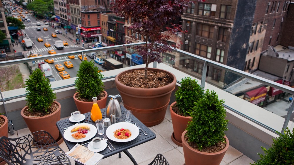 outdoor table with food overlooking New York street